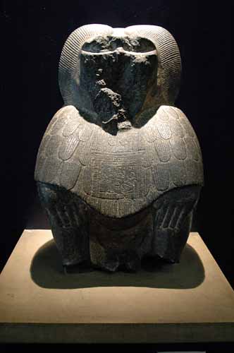 Black granite seated baboon