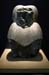 Black granite seated baboon